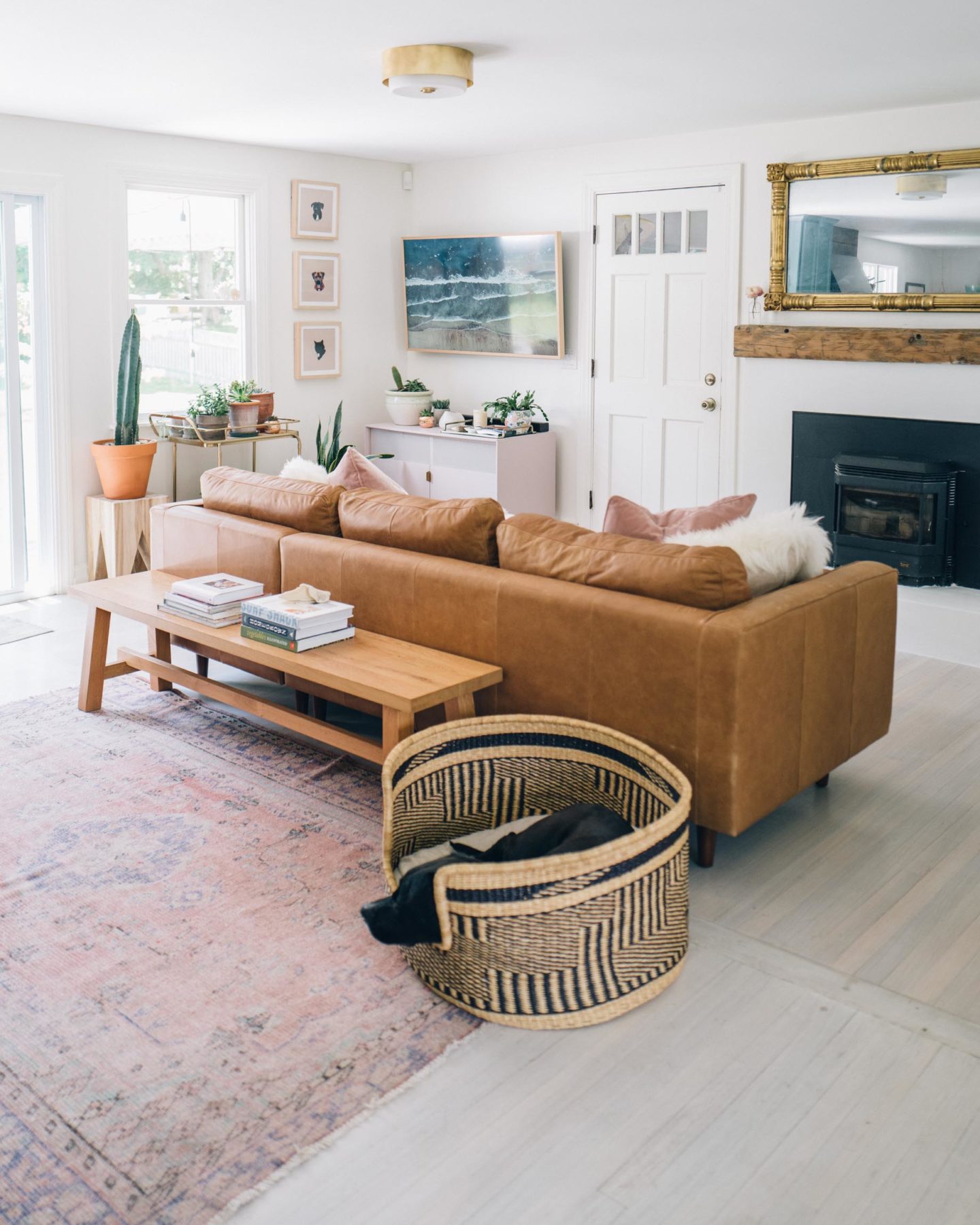 Jess Ann Kirby's most recent living room renovations include an updated fireplace, the Sven Sectional from Article and updated light fixtures.