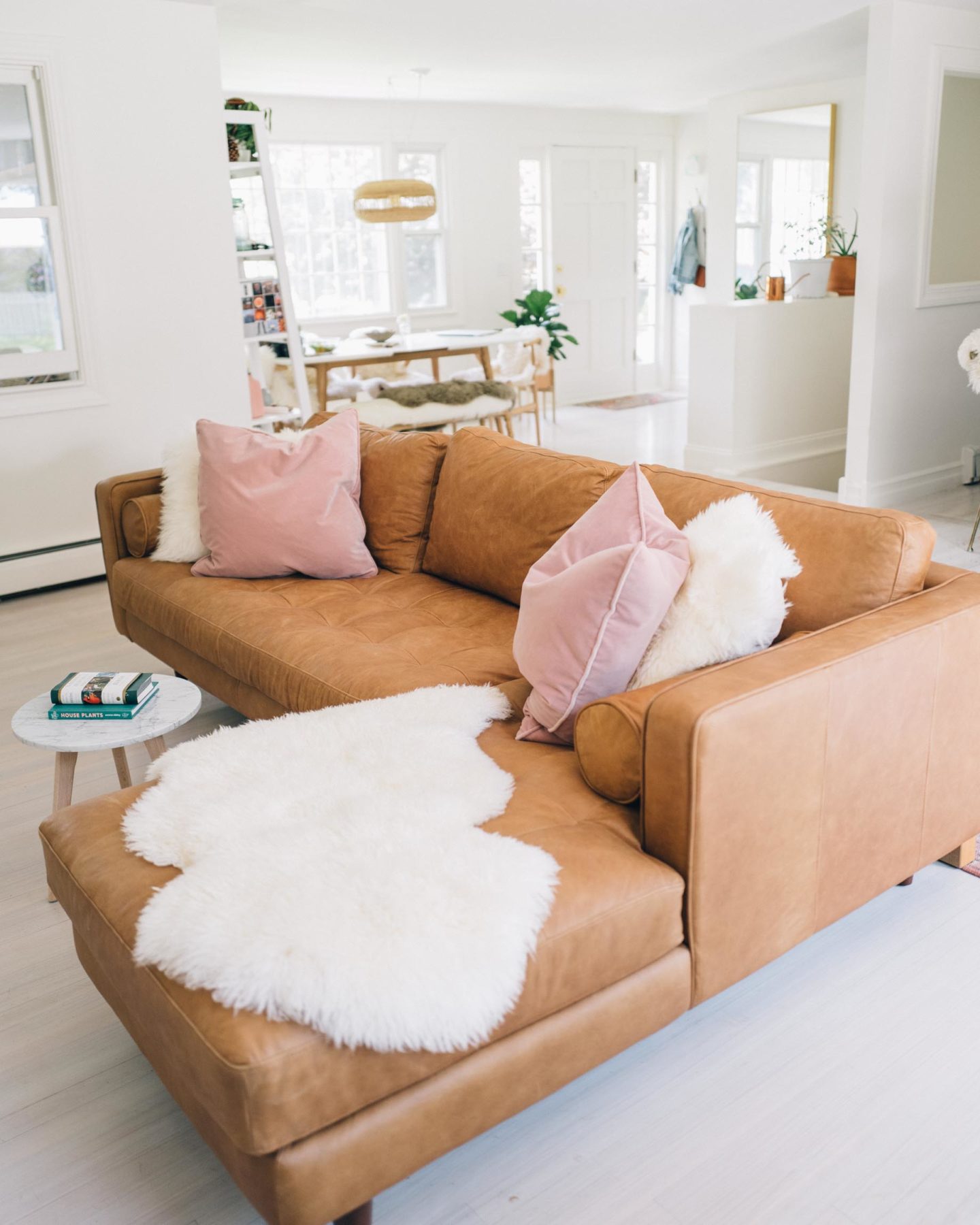 Jess Ann Kirby styles the Article Sven Sectional with white faux fur throws and suede pillows.