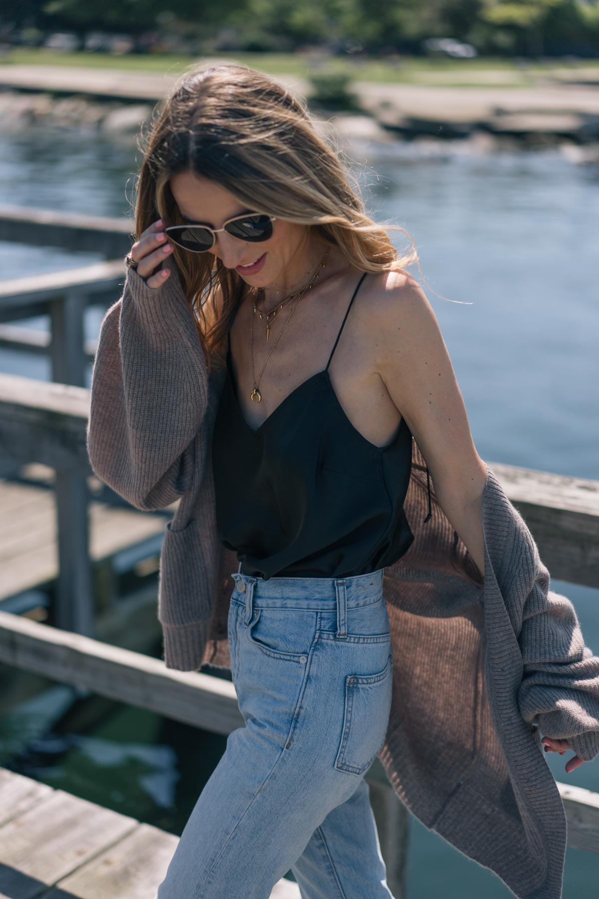 Jess Ann Kirby styles a silk tanktop with Madewell perfect summer jeans and a cashmere cardigan