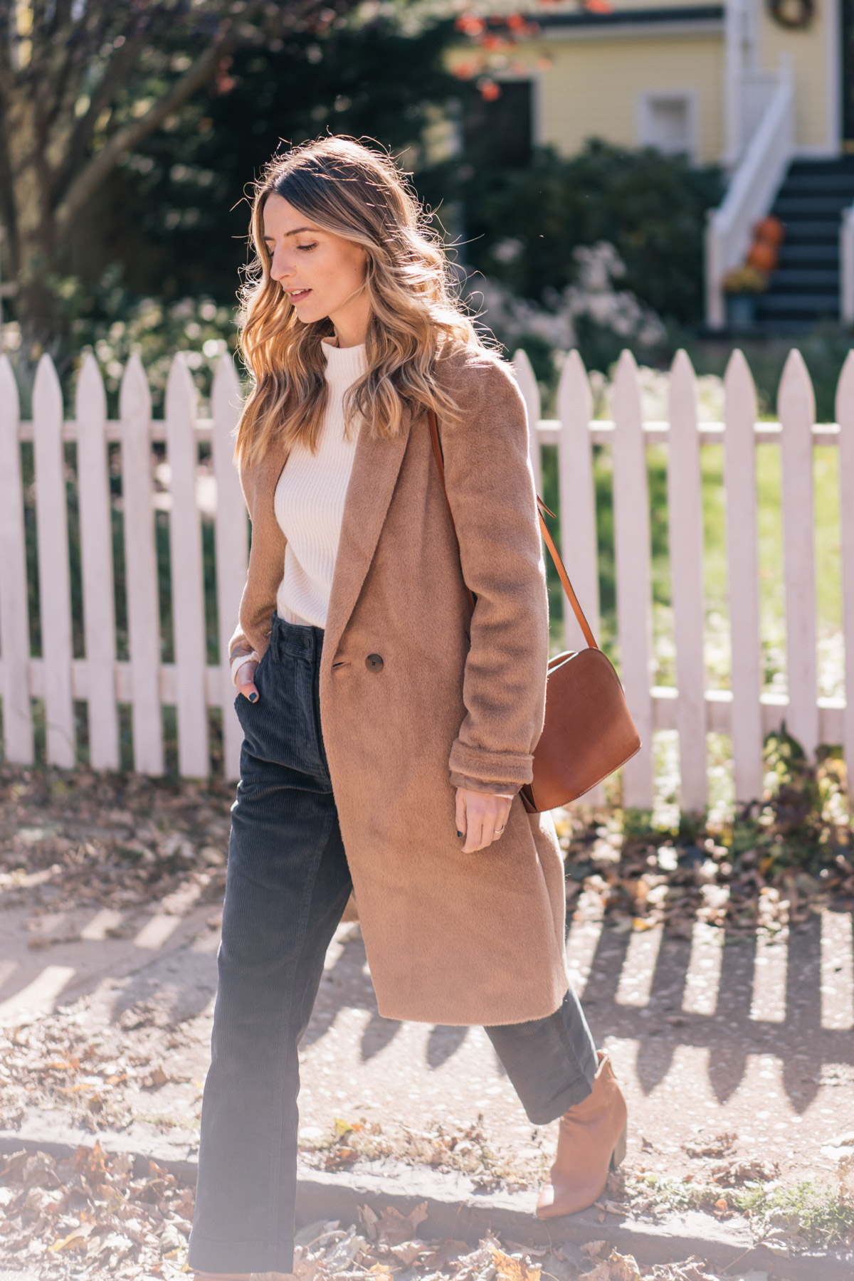 Jess Ann Kirby wears Everlane Corduroys and a cashmere sweater for a textured fall outfit