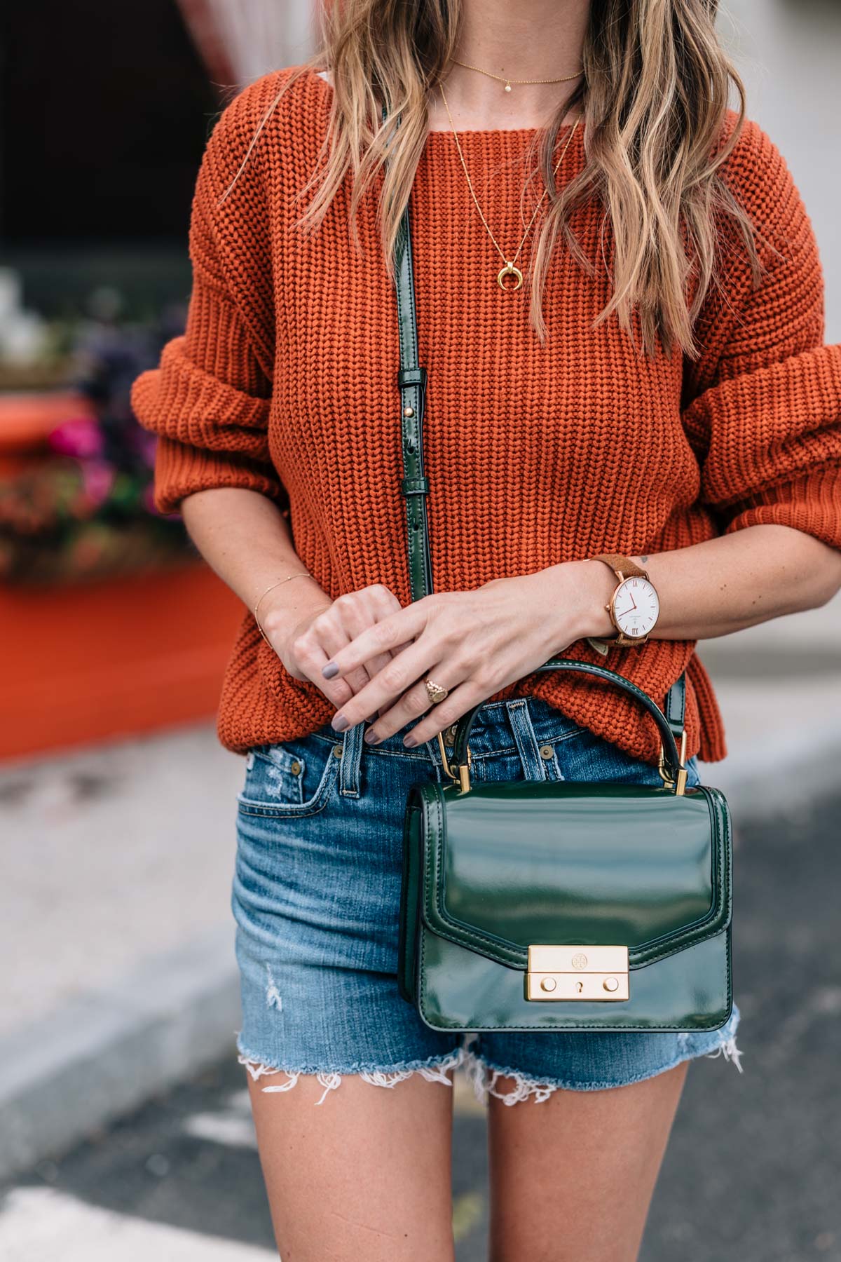 Jess Ann Kirby styles the fall color trend autumn maple in a chunky knit sweater with the tory burch juliette mini satchel