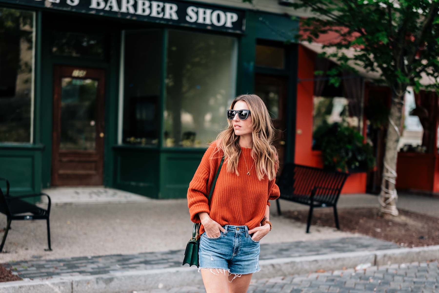 Fall style inspiration from Jess Kirby in a chunky knit sweater and jean shorts