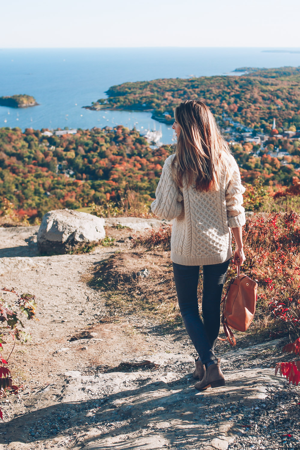 Jess Ann Kirby overlooks the harbour in Camden, Maine for a view of fall foliage.