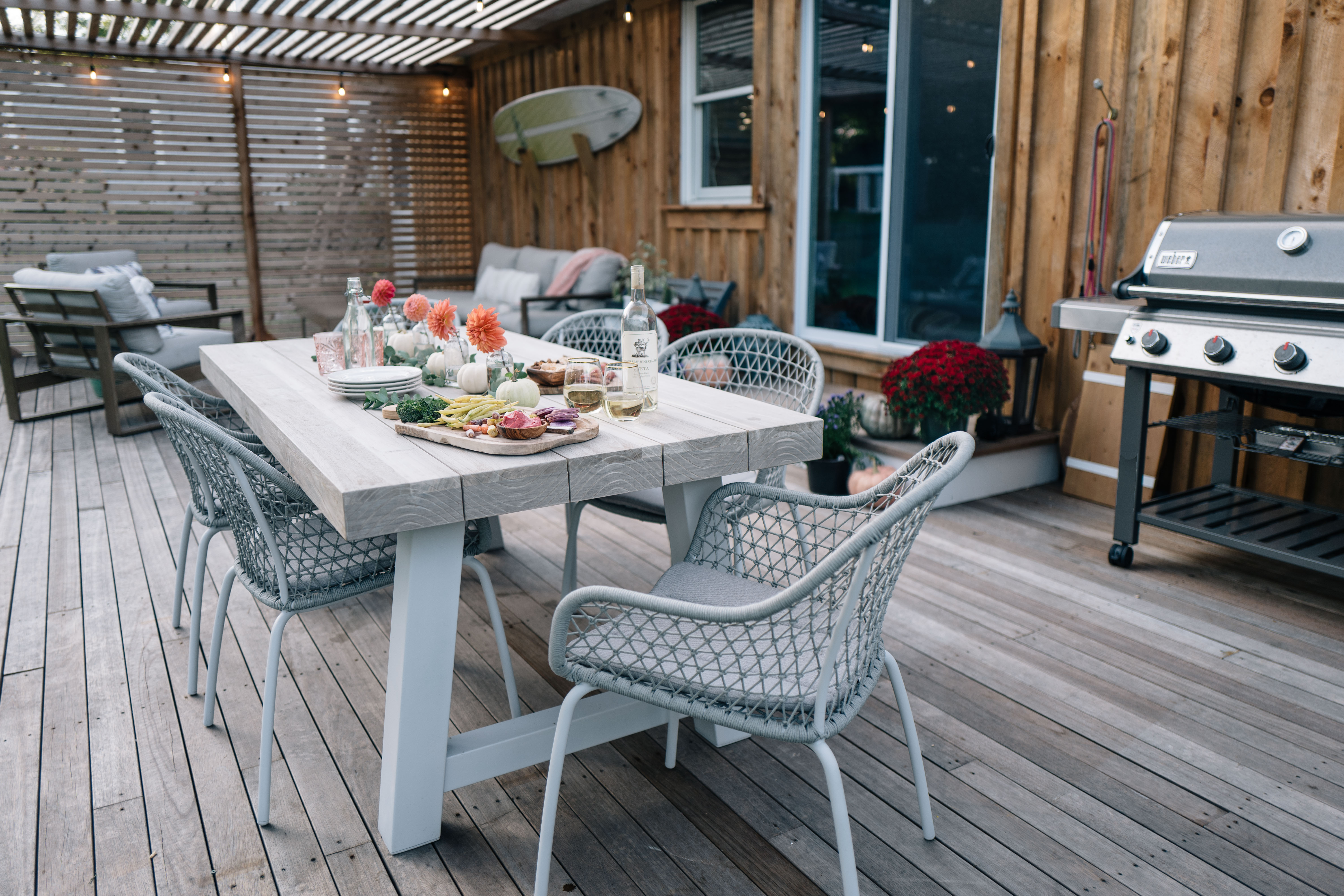 Jess Ann Kirby reveals her backyard renovation with a brand new deck and an Article Tavola teak dining table