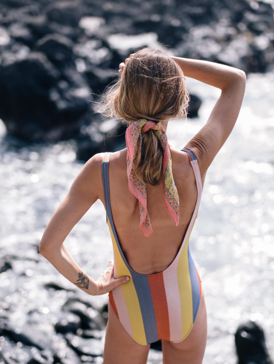 Jess Ann Kirby soaks in the sun in a Solid and Striped Anne Marie One Piece bathing suit in Hawaii | My Favorite Mineral Sunscreen