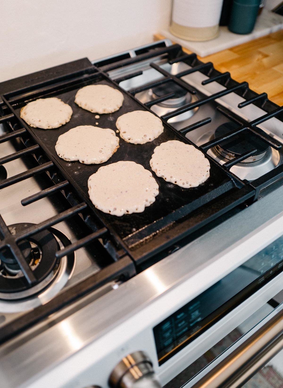 Jess Ann Kirby makes mixed berry healthy vegan pancakes with the Cafe Appliances Matte White Range and griddle.