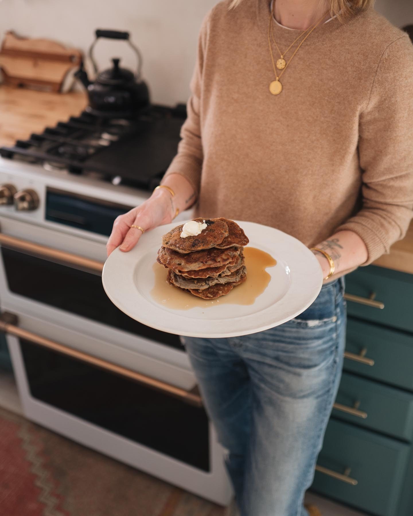 Jess Ann Kirby makes her recipe for mixed berry healthy vegan pancakes with the Cafe Appliances Matte White Range and griddle.