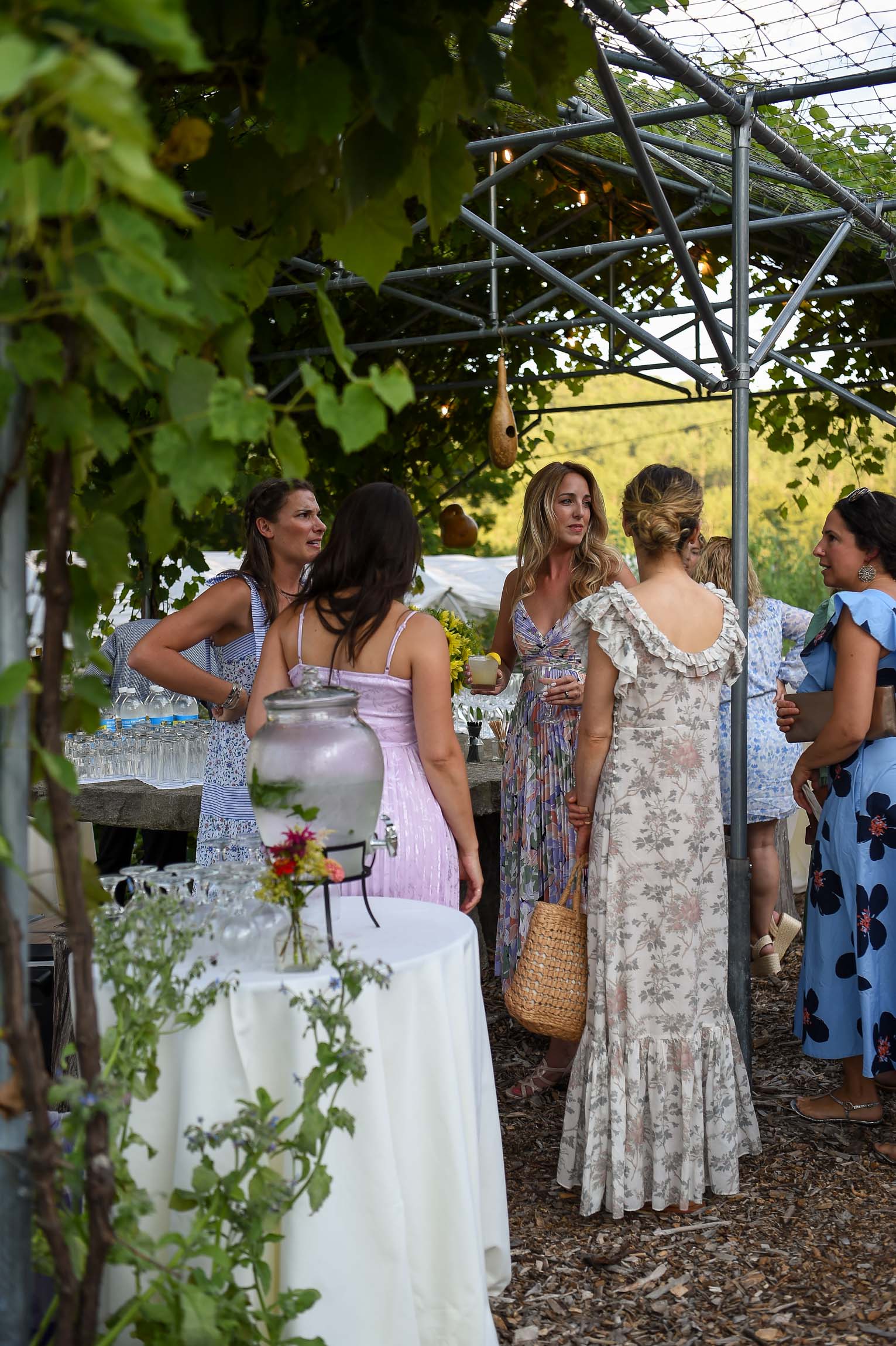 Women in floral dresses garden party