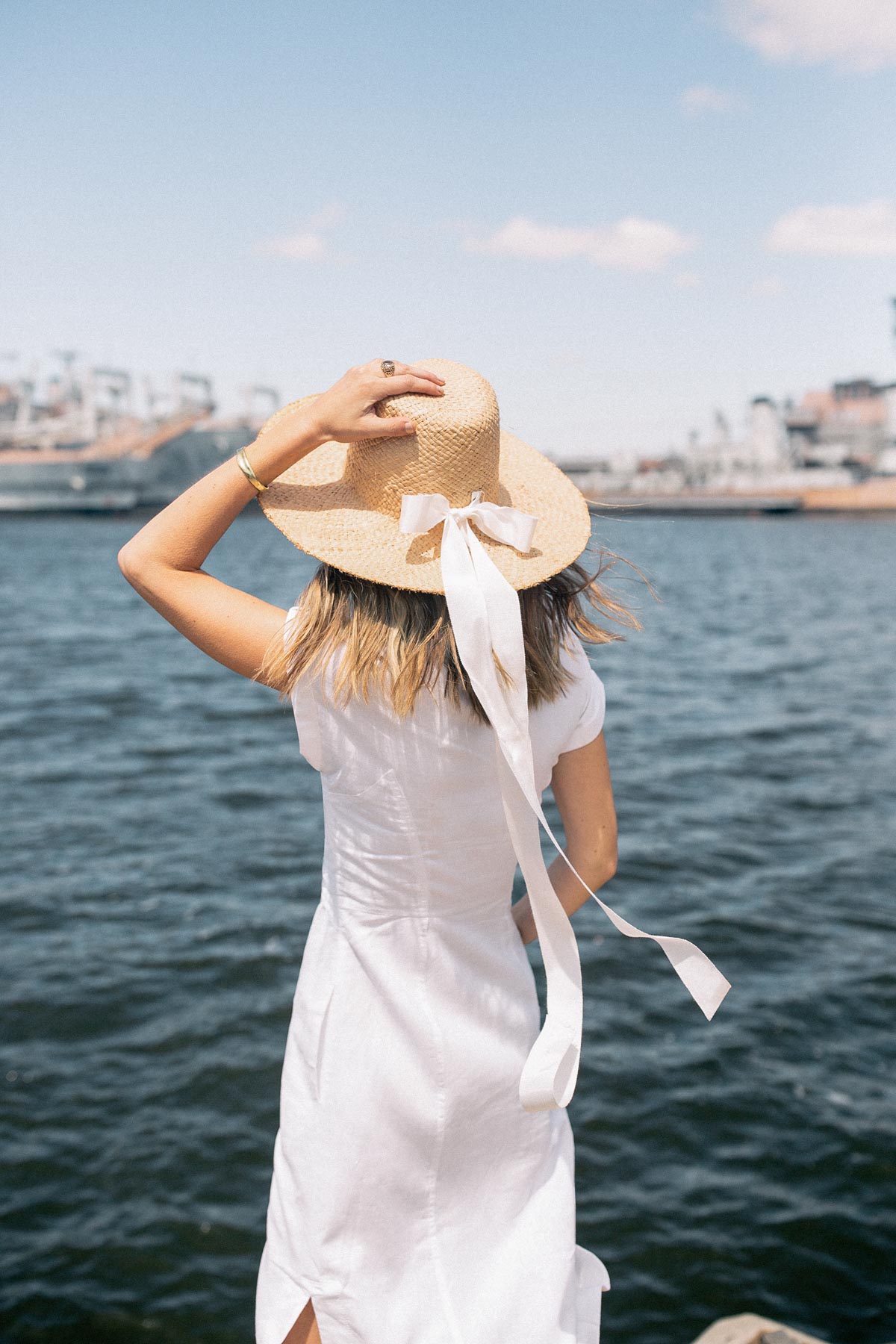 Jess Ann Kirby spends 48 hours in Philadelphia in a straw hat and white dress from Anthropologie.