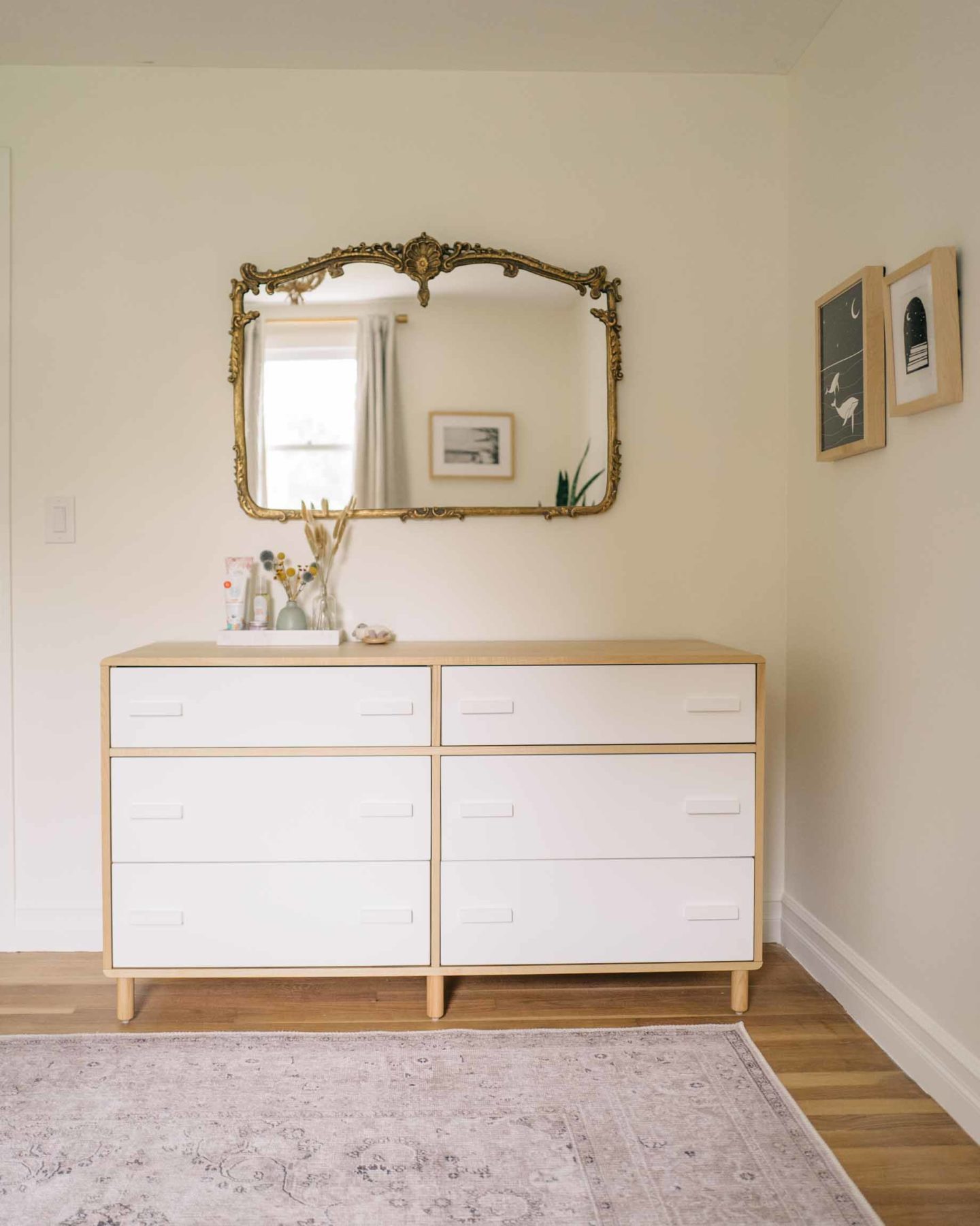 Jess Ann Kirby's gender neutral nursery has sweet details, like a brass mirror and illustrations, for her baby.