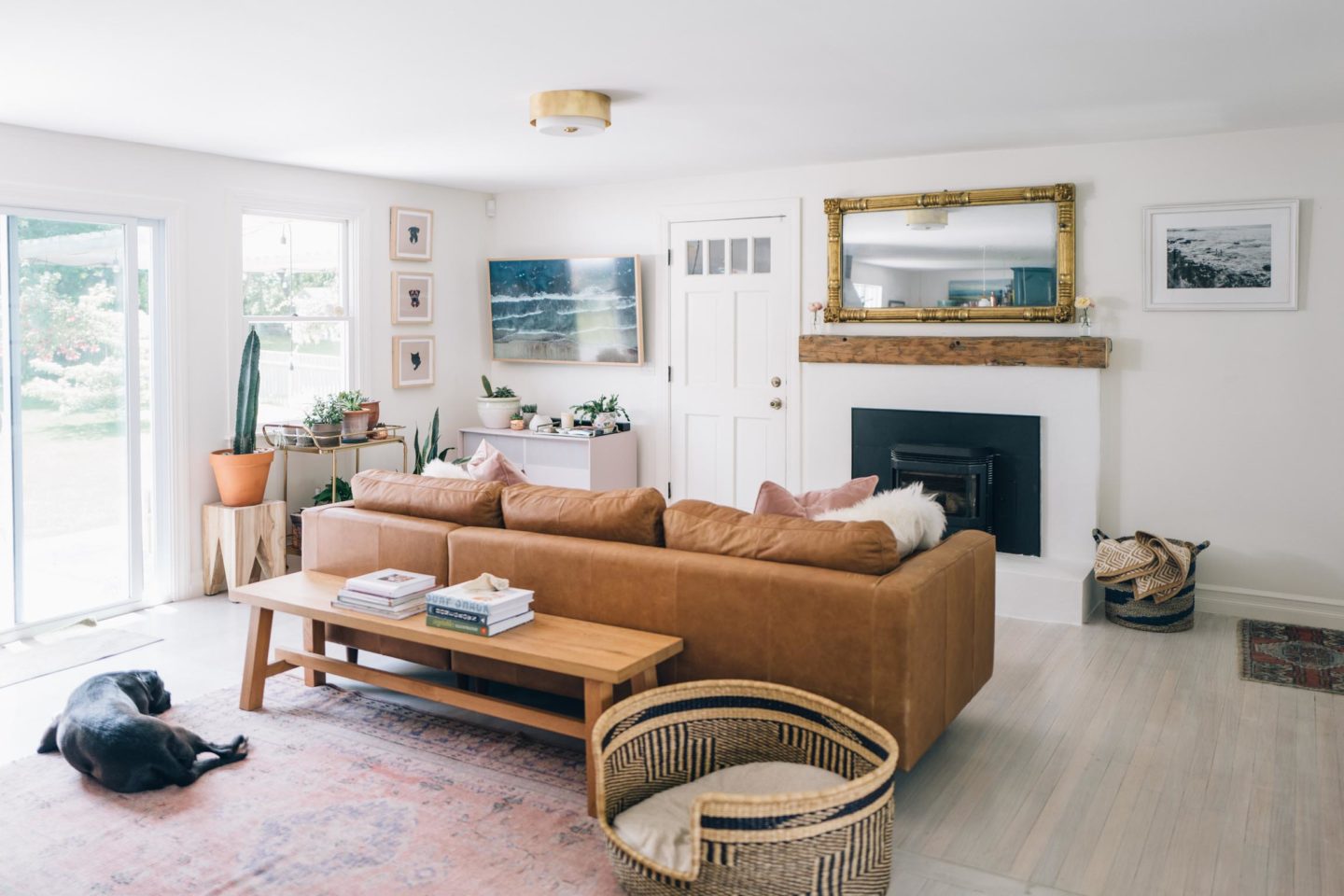 Jess Ann Kirby's new living room includes a brown leather sectional as the focal point.