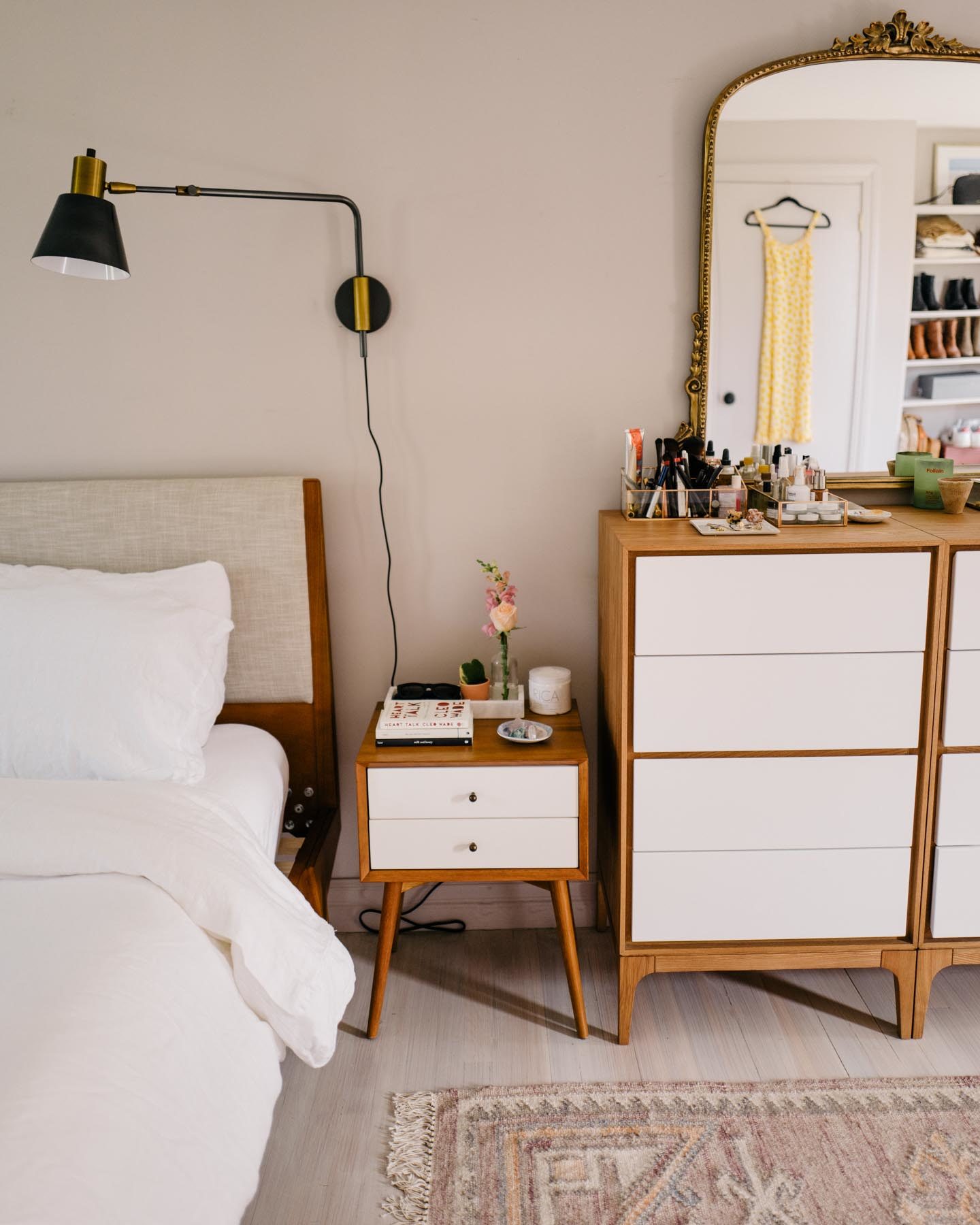 Jess Ann Kirby added a matching side table to her master bedroom decor with hanging lamps.