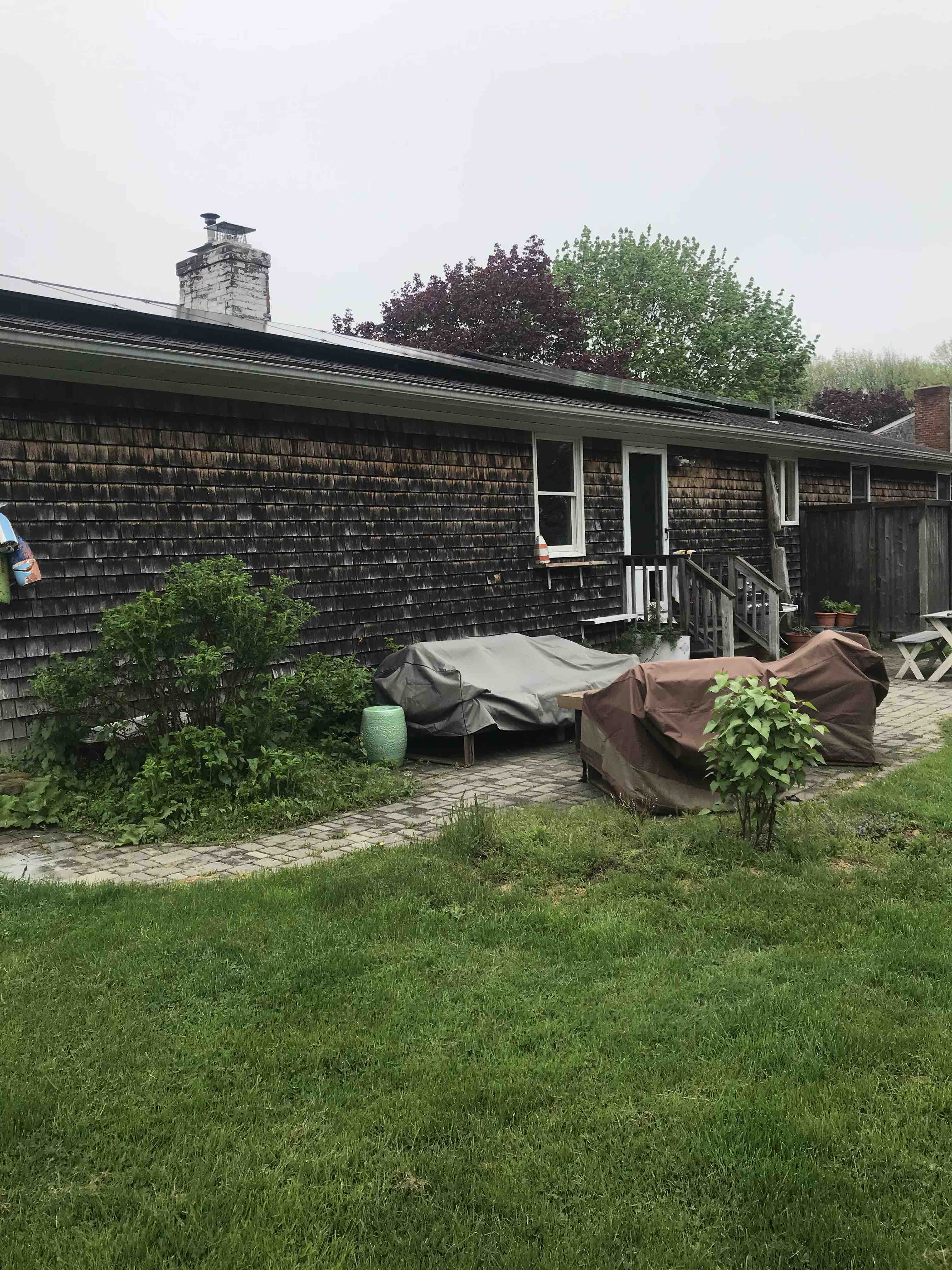 Jess Ann Kirby's backyard before renovation did not include a pergola or deck